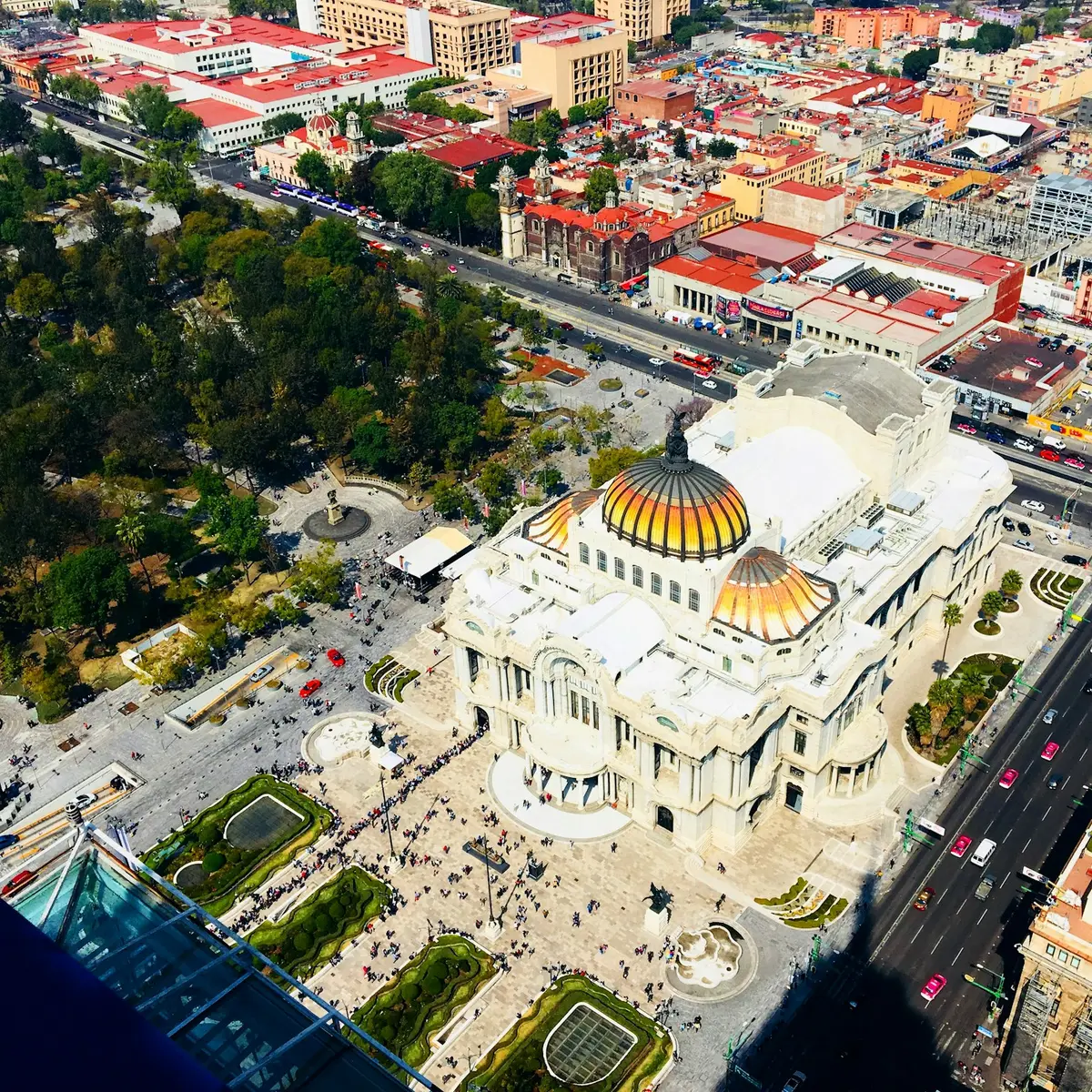 Aerial view of the Palacio de Bellas Artes and the rooftops of central Mexico City in bright daylight
